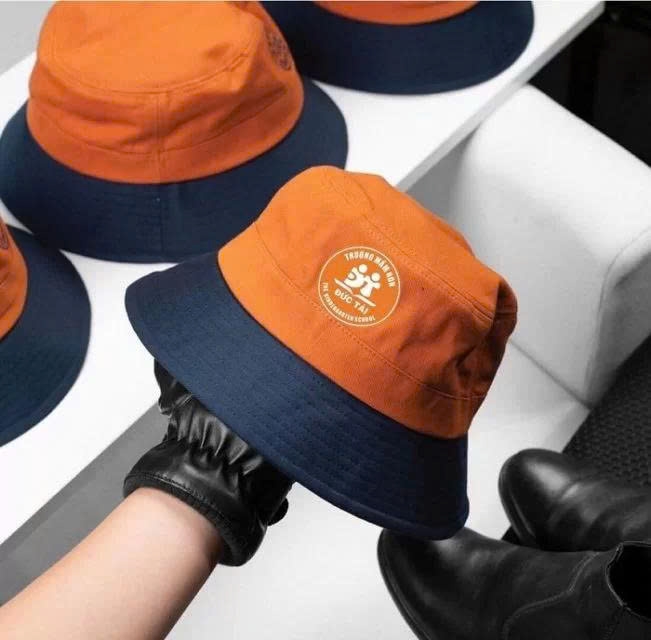 May nón đồng phục tại Dĩ An